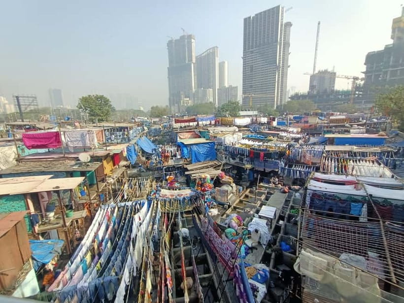 Mumbai: Dharavi Slum and Dhobi Ghat Tour with Train Ride - Riding Mumbai’s local train